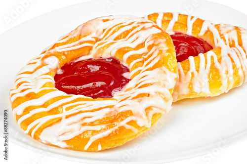 Delicious danish pastry on a plate, isolated on white background