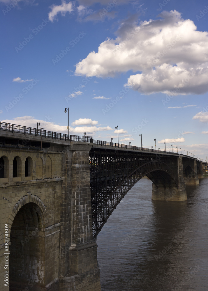 vertical shot of Eads bridge across the Mississippi in St. Louis, MO