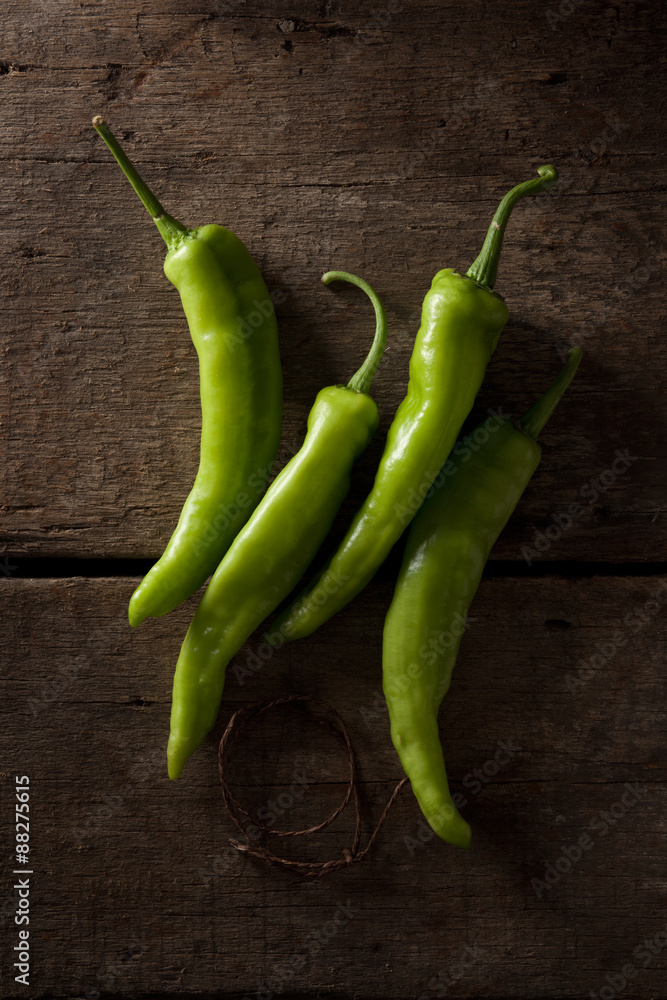 fresh chili isolated on a wood background fresh chili isolated on a wood background