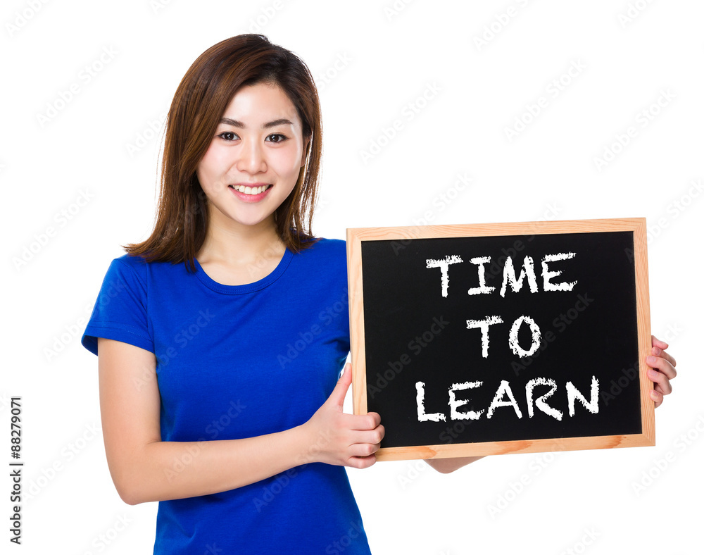 Young woman with blackboard showing phrase of time to learn Young woman with blackboard showing phrase of time to learn