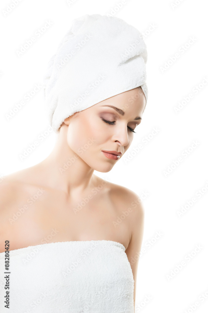 Attractive girl in towel isolated on white. Spa, wellness and health care concept. Attractive girl in towel isolated on white. Spa, wellness and health care concept.