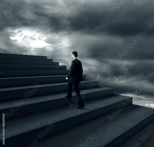 businessman climbing on stairs