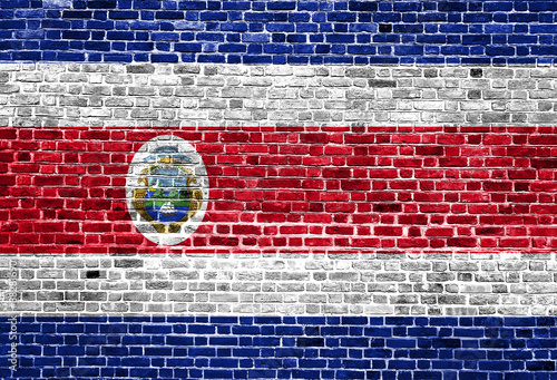 Flag of Costa Rica painted on brick wall, background texture 1