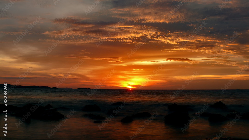 Dramatic sunset over the ocean with clouds, highlighted from the down by the evening sun. Shot near Bali Hai lighthouse, Pattaya, Thailand. Timelapse FullHD 1080p. Dramatic sunset over the ocean with clouds, highlighted from the down by the evening sun. Shot near Bali Hai lighthouse, Pattaya, Thailand. Timelapse FullHD 1080p.