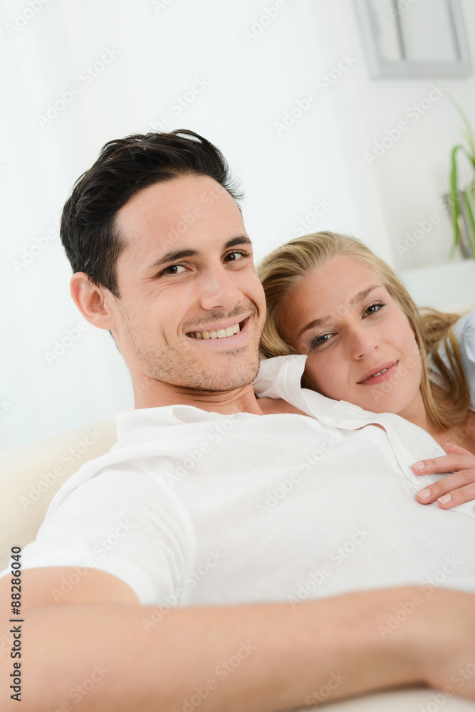 beautiful and happy young couple in love relaxed at home beautiful and happy young couple in love relaxed at home