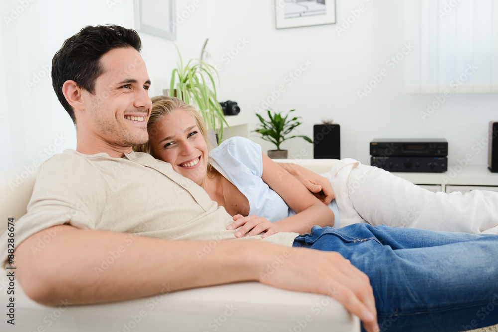 beautiful and happy young couple in love relaxed at home beautiful and happy young couple in love relaxed at home