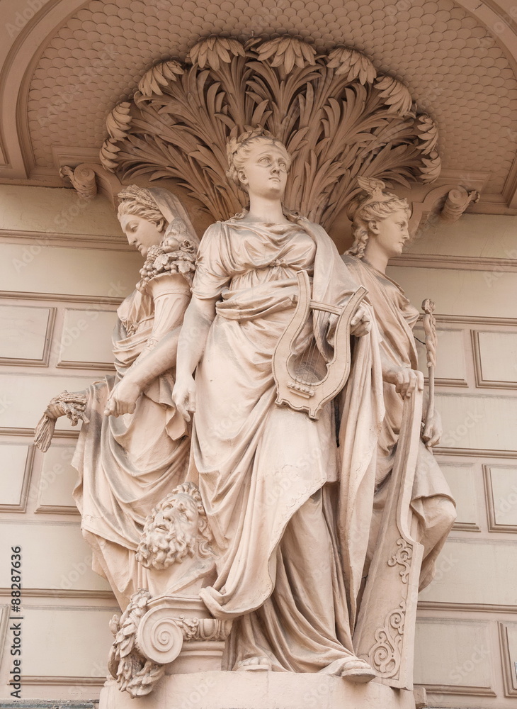 Fototapeta premium Allegorical figures - Fertility, Art, Commerce decorated old house on the street in St. Petersburg