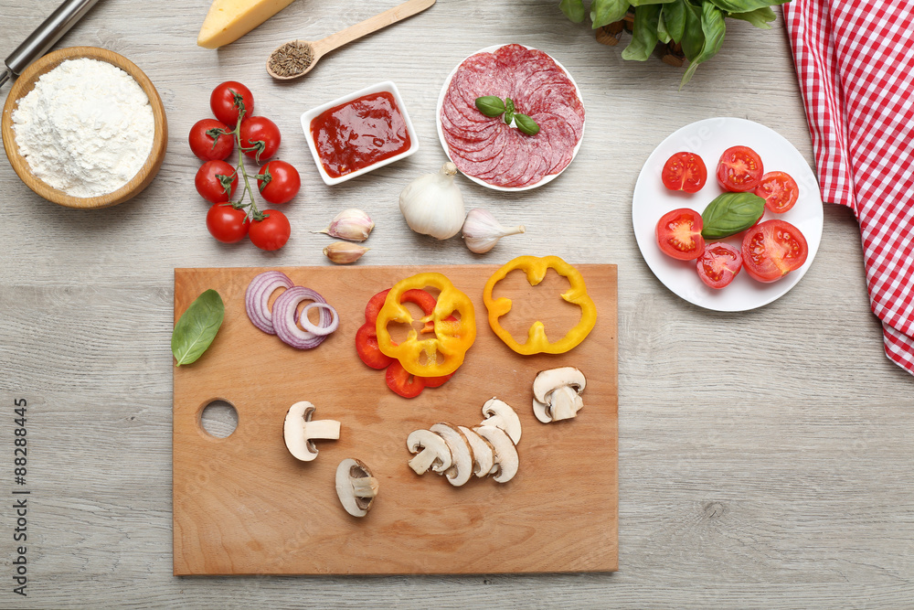 Food ingredients for pizza on table close up Food ingredients for pizza on table close up