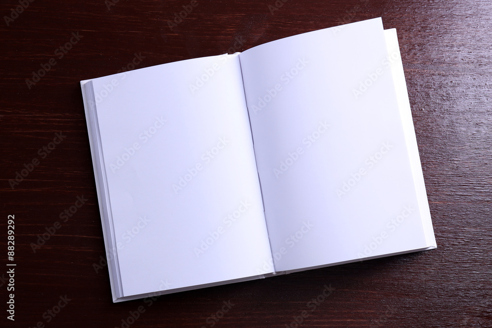 Blank open book on wooden background Blank open book on wooden background