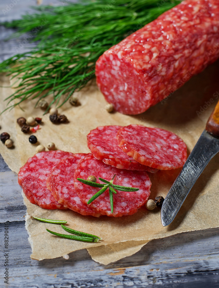 Sliced italian salami with rosemary Sliced italian salami with rosemary