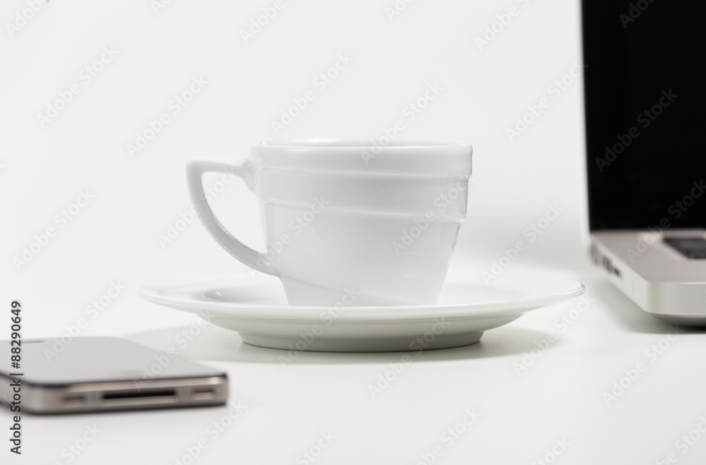 coffee cup, phone and laptop on a white background coffee cup, phone and laptop on a white background