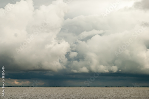 Cloudscape of ominous storm and rain clouds, so called cumulonimbus over Waddensea, Netherlands