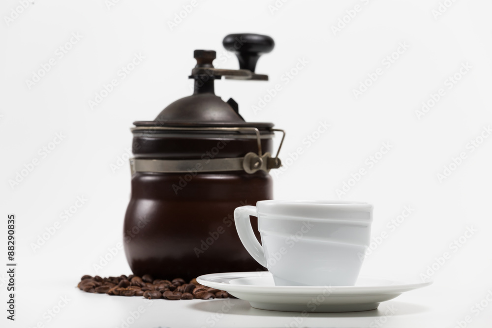 Coffee grinder with bean and coffee cup isolate on white Coffee grinder with bean and coffee cup isolate on white
