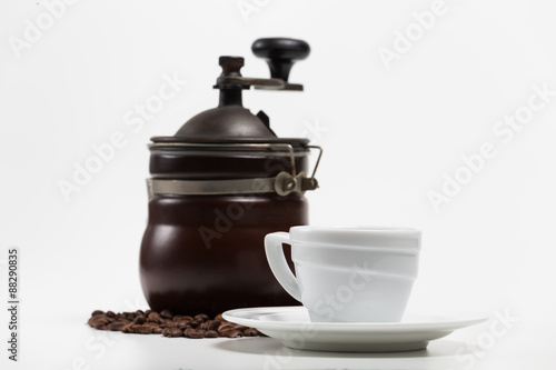 Coffee grinder with bean and coffee cup isolate on white