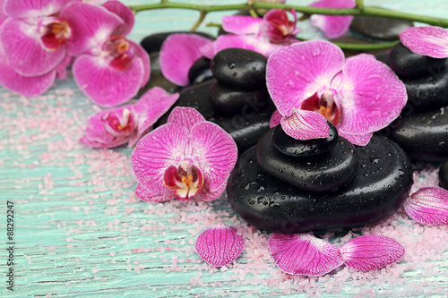 Violet orchid and zen stones close-up