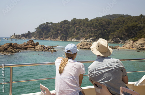 couple looking to shore from boat