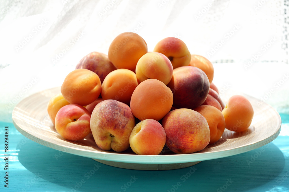 Heap of fresh fruits on windowsill
