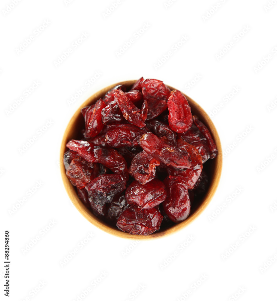 Dry dogwood fruits in wooden bowl, isolated on white Dry dogwood fruits in wooden bowl, isolated on white