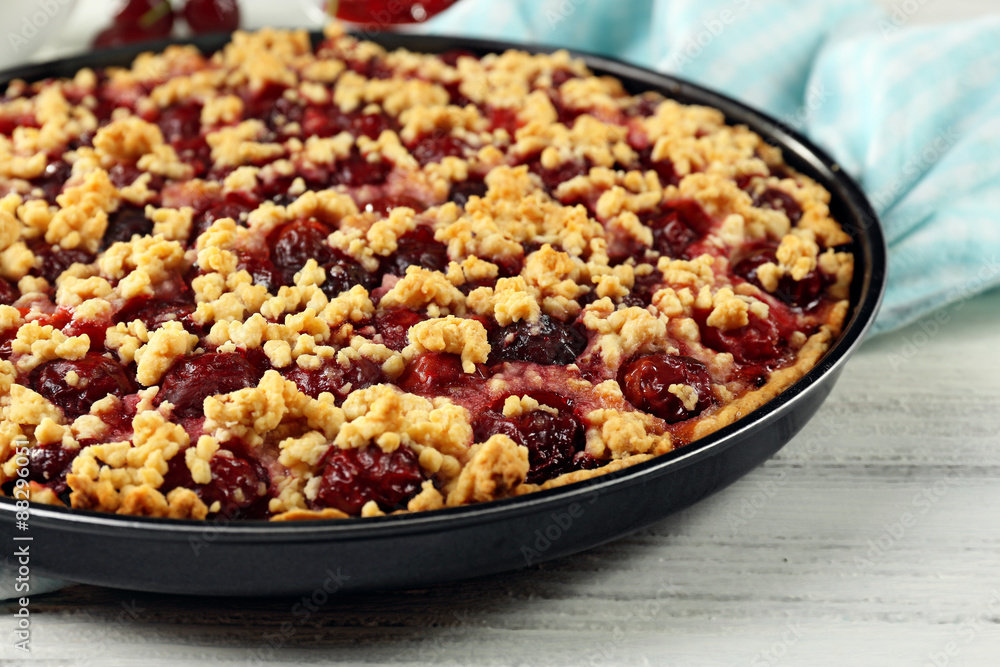 Tasty homemade pie with cherries on table close up Tasty homemade pie with cherries on table close up