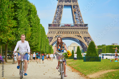 Young couple using bicycles in Paris, France © Ekaterina Pokrovsky