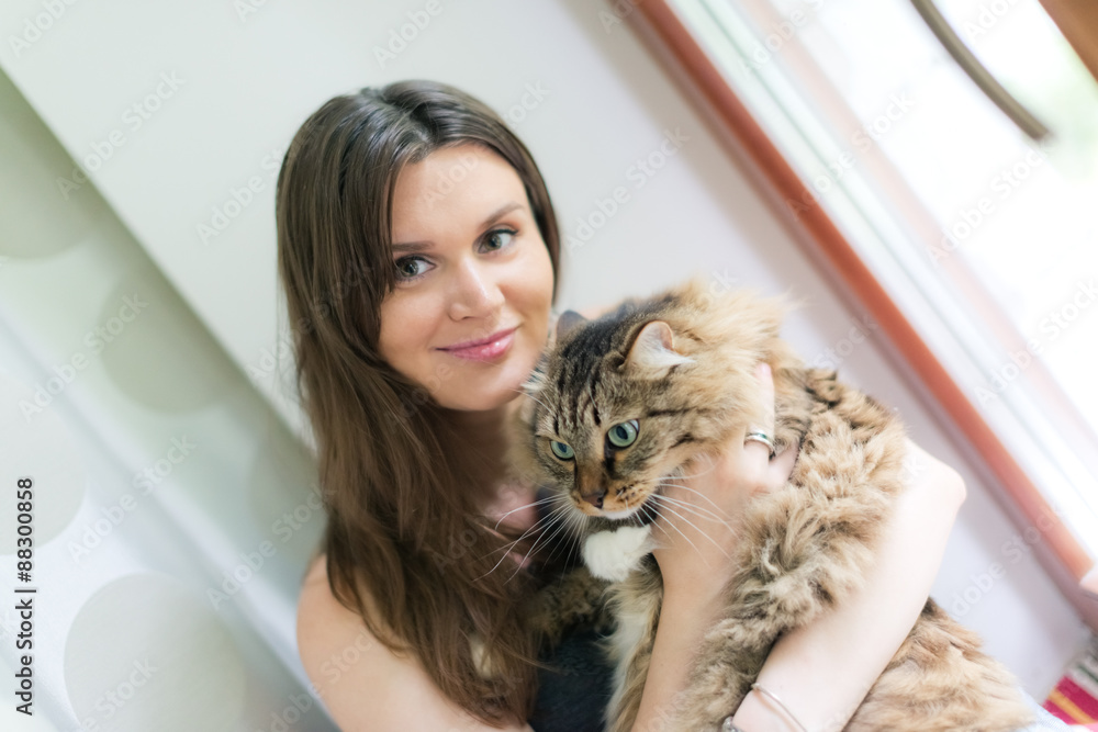 beautiful smiling brunette girl and her ginger cat beautiful smiling brunette girl and her ginger cat