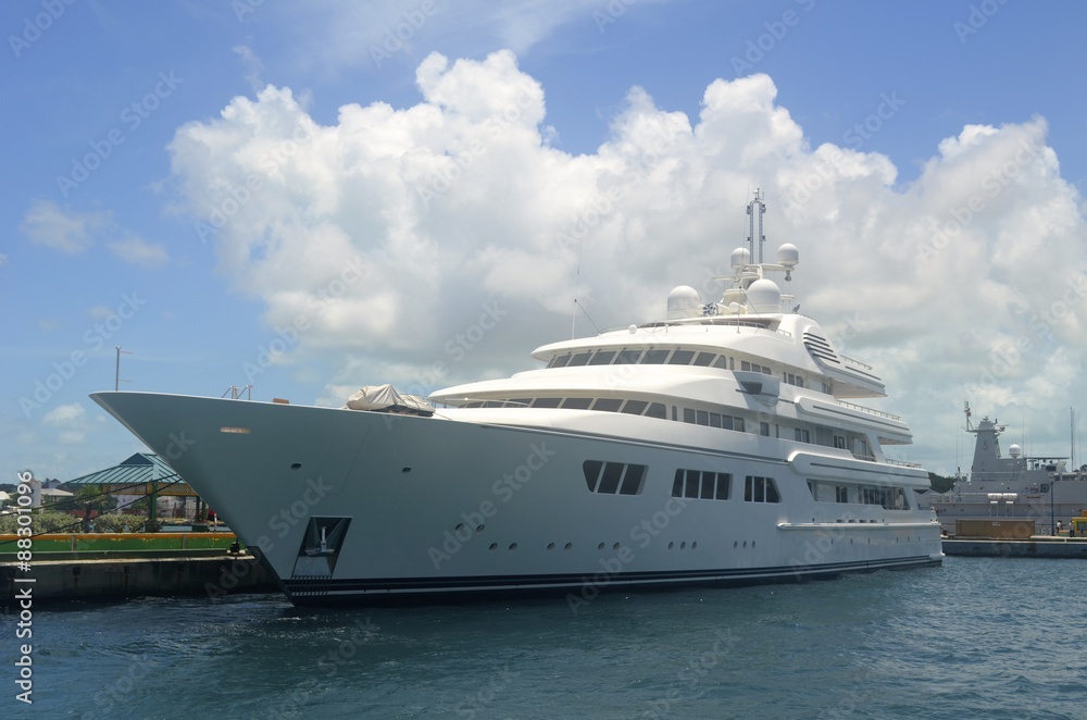 White Mega Yacht Moored at the Cruise Ship port in Nassau,Bahamas White Mega Yacht Moored at the Cruise Ship port in Nassau,Bahamas
