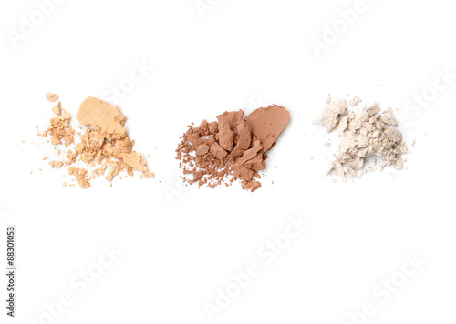 Fotografie Three shade colors of make-up powder on white background