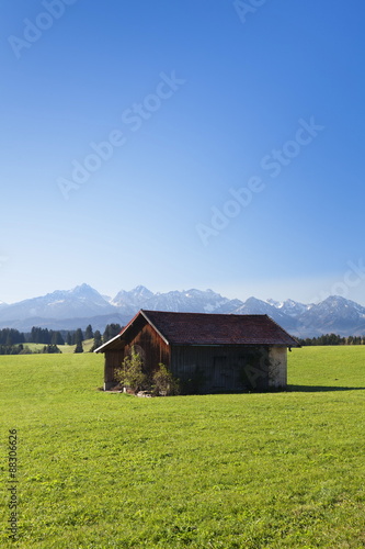 Cottage in Prealps landscape, Fussen, Ostallgau, Allgau, Allgau Alps, Bavaria, Germany photo