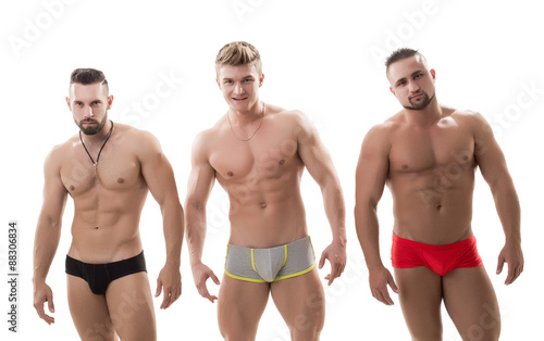 Photo of three sexy macho with bare torsos