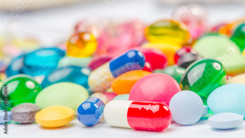 Many pills and tablets isolated on white background