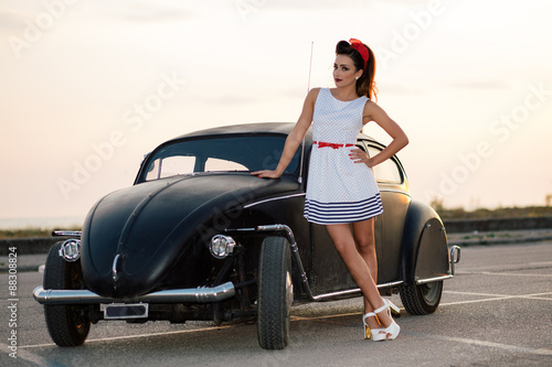 Beautiful pin-up with vintage car