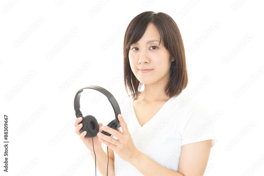 ヘッドフォンを持つ女性 ヘッドフォンを持つ女性