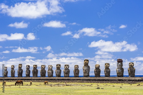 Horses grazing at the 15 moai restored ceremonial site of Ahu Tongariki on Easter Island (Isla de Pascua) (Rapa Nui), Chile photo