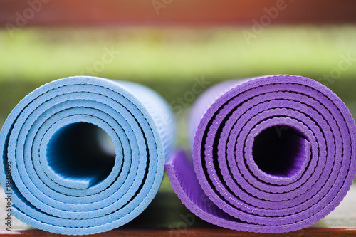 yoga mats on the table in a garden