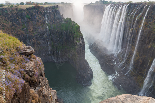 Victoria Falls from Zambia side at dusk  rocks in the foreground