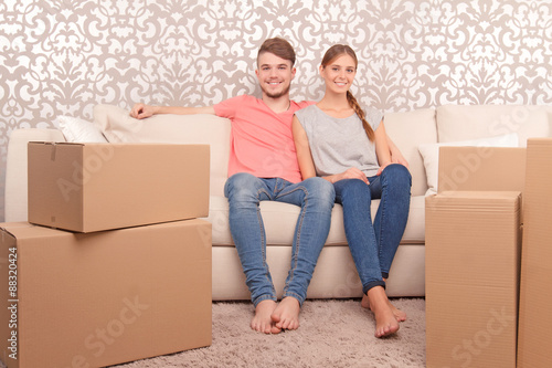 Young couple siting on sofa  © zinkevych