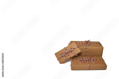 Fototapeta Naklejka Na Ścianę i Meble -  Packages wrapped in brown paper isolated on white background with copy space