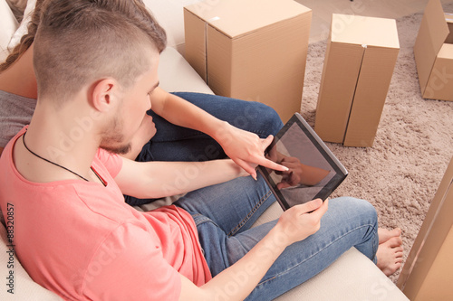 Nice couple holding laptop  photo