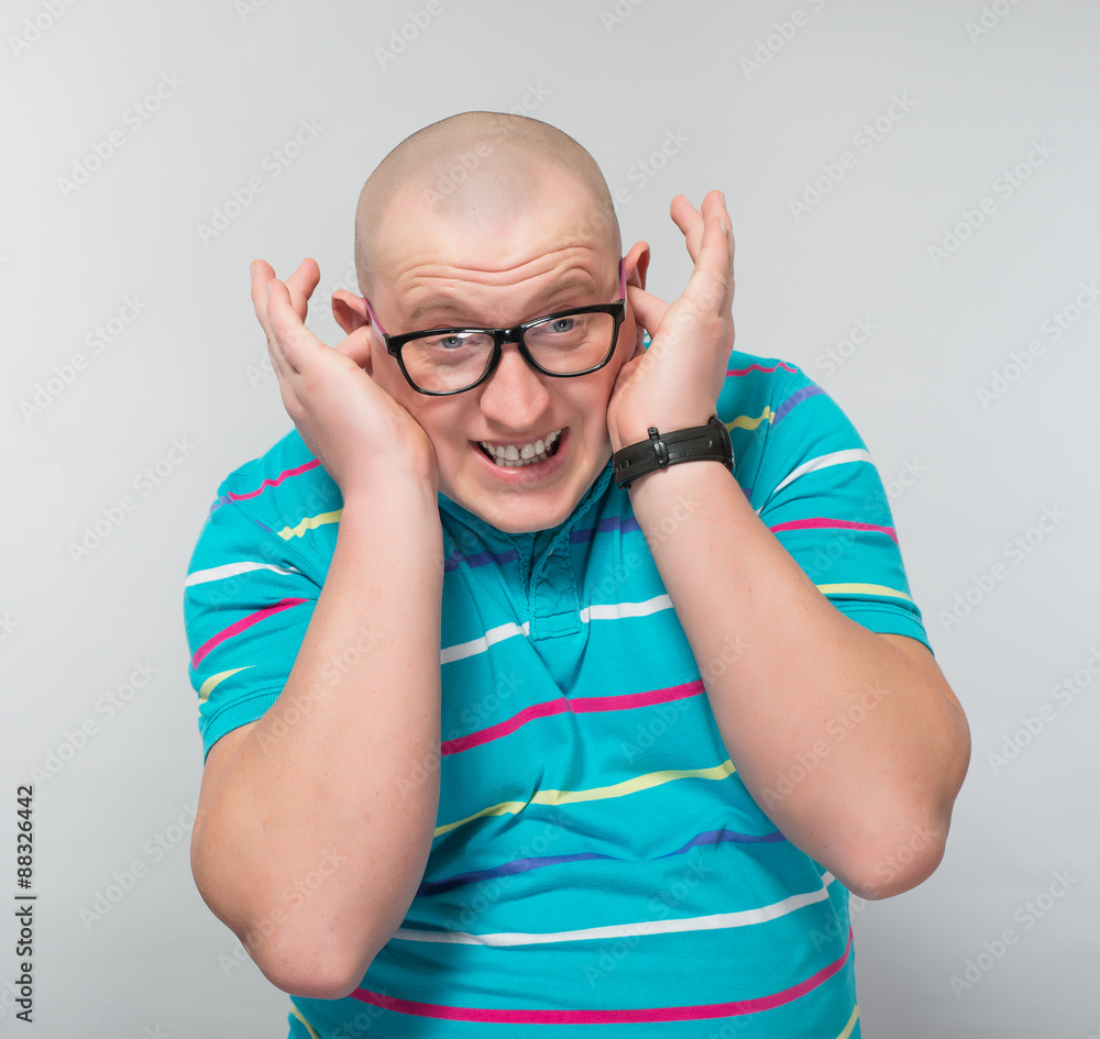 a man covering his ears, loud sound a man covering his ears, loud sound