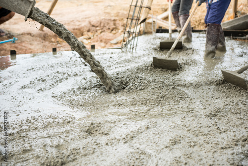 Concrete pouring during commercial concreting floors of building