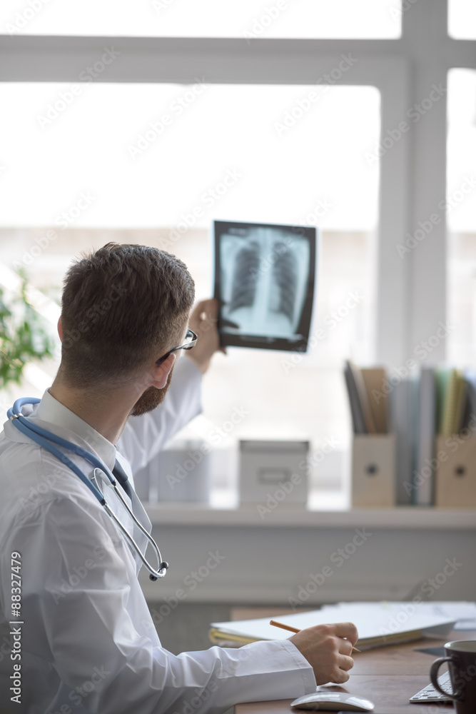 Doctor examining an lungs x-ray Doctor examining an lungs x-ray