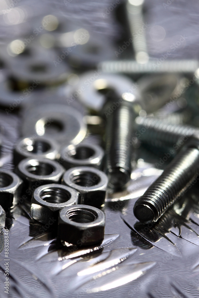 Nuts bolts washers.
Various nuts bolts and washers on a steel background. Nuts bolts washers.
Various nuts bolts and washers on a steel background.