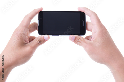 hands holding mobile smart phone with blank screen isolated on w