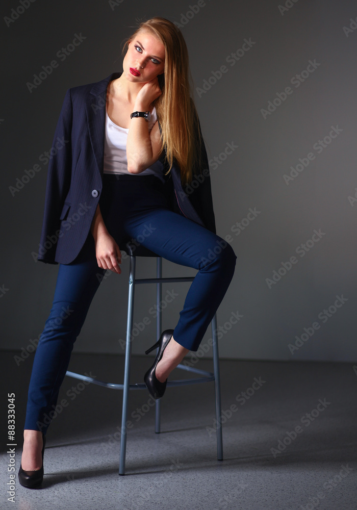 Young woman sitting on a chair Young woman sitting on a chair