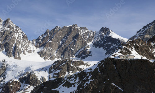 The Marinelli Hut hidden at the foot of the mountain range in Valmalenco, Valtellina, Lombardy photo