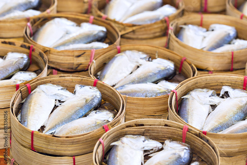 Steamed fish, Plaa Tuu (mackerel) in bamboo steamers at the seafood market photo