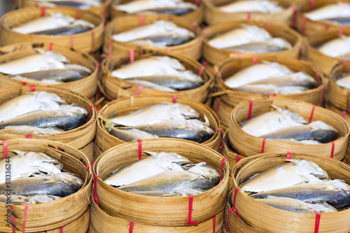 Steamed fish, Plaa Tuu (mackerel) in bamboo steamers at the seafood market photo