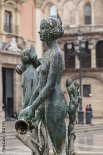 Maiden statue, Central Fountain representing Rio Turia, and cathedral, Plaza de la Virgen, Valencia, Spain photo