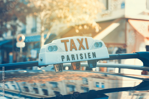Parisian taxi  with car reflection. Retro filter effect