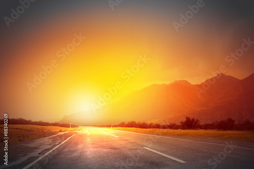 Sunrise above road